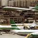 A Cathay Pacific Lockheed Tri-star jet lands at Hong Kong's Kai Tak international airport August 6 to join others gathered on the tarmac - RTXFAVT